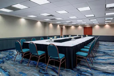 a large conference room with a long table and chairs at Fairfield Inn & Suites by Marriott Kelowna in Kelowna