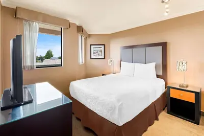 a hotel room with a bed and a window at Best Western PLUS Inner Harbour Hotel in Victoria