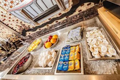 a bunch of food on a counter in a kitchen at Service Plus Inns and Suites Calgary in Calgary