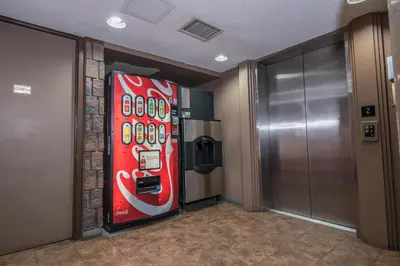 a coca cola vending machine in a elevator at Argyll Plaza Hotel in Edmonton