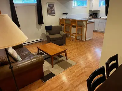 a living room with a couch and a table at Revelstoke Long Term in Revelstoke