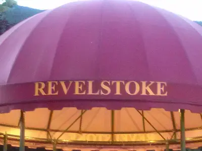 a purple umbrella with the words receussage on it at Revelstoke Long Term in Revelstoke