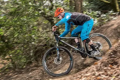 a man riding a bike on a dirt trail at The Perch at Moon Dance in Garden Bay