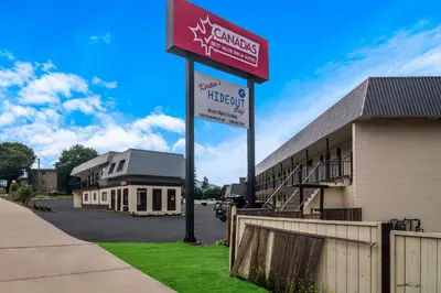 a sign for a hospital in front of a building at Canadas Best Value Inn & Suites Kamloops in Kamloops