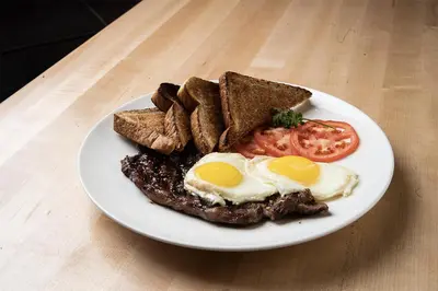 a plate of food with eggs and toast on a table at River Cree Resort & Casino in Edmonton