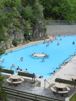 a group of people swimming in a pool at Mountain View Radium Condo - Copper Horn Village in Radium Hot Springs