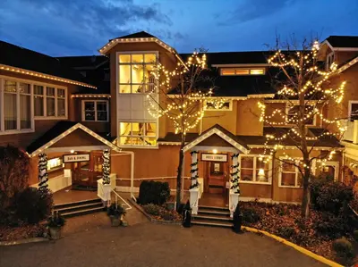 a house with christmas lights on the front of it at Hotel Eldorado at Eldorado Resort in Kelowna