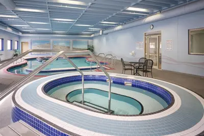 a pool in a building with two swimming pools at Best Western Plus Kamloops Hotel in Kamloops