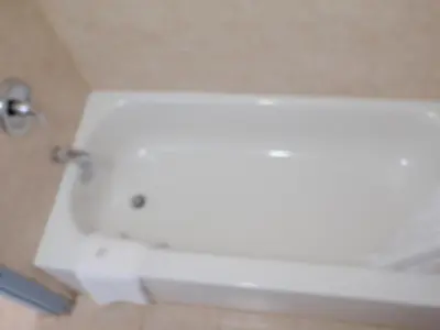 a white bath tub in a bathroom at Trans Canada Motel in Kamloops