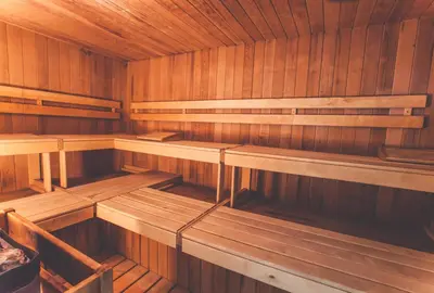 an empty wooden sauna with wooden benches in it at Glacier House Hotel & Resort in Revelstoke