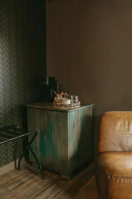 a wooden table in a room with a chair at Creekside Villa in Canmore