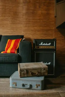 a living room with a couch and a suitcase at Creekside Villa in Canmore