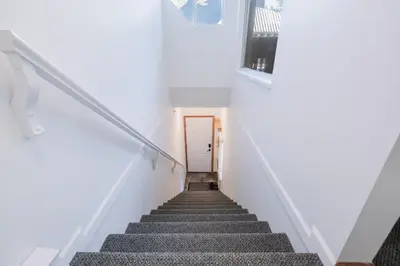 a staircase leading up to a door in a house at Lagoons by Outpost Whistler in Whistler
