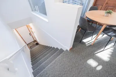an overhead view of a staircase with a table and chairs at Lagoons by Outpost Whistler in Whistler