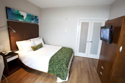 a hotel room with a bed and a tv at Baymont by Wyndham Fort McMurray in Fort McMurray