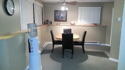 a dining room with a table and chairs and a blender at Akiskinook Sandy Beach Lakefront Resort! Tennis, Pickle, Basket Ball Courts, Indoor Pool, Hot Tub, Squash Court! Short Drive to Radium or Fairmont Hot Springs! in Invermere