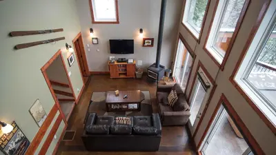 an overhead view of a living room with a couch at Cedar House Restaurant & Chalets in Golden