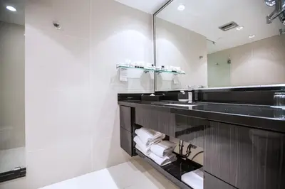 a bathroom with a sink and a mirror at Granville Island Hotel in Vancouver