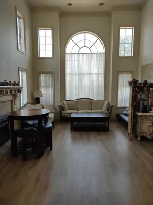 a living room with a couch and a table at Go House in Richmond