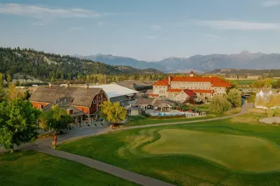 an aerial view of a resort with a golf course at St. Eugene Golf Resort & Casino in Cranbrook