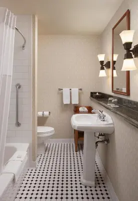a bathroom with a sink and a tub and a toilet at St. Eugene Golf Resort & Casino in Cranbrook