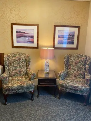 two chairs and a lamp in a hotel room at Kingston Hotel in Vancouver