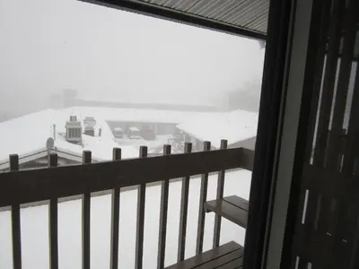 a balcony with a view of a harbor in the snow at Star Lodge in Kamloops