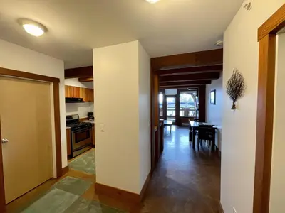 a kitchen and dining room with a table in it at Great Condo In Excellent Location - Waterfront Building - Seaside in Ucluelet