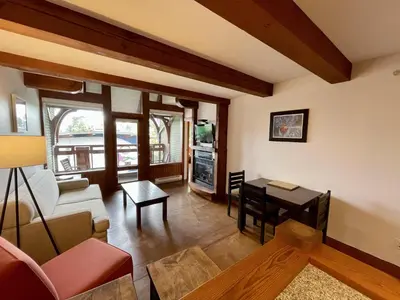 a living room with a couch and a table at Great Condo In Excellent Location - Waterfront Building - Seaside in Ucluelet