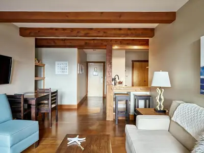 a living room with a couch and a table at Beautiful Condo In A Great Location, Oceanfront Complex - Oe in Ucluelet