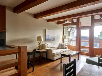 a living room with a couch and a table at Beautiful Condo In A Great Location, Oceanfront Complex - Oe in Ucluelet