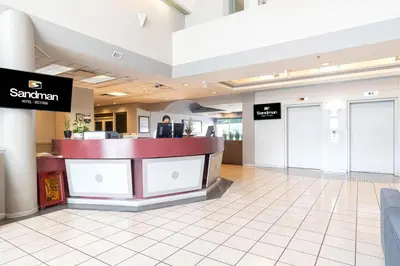 a lobby of a santaran store with a counter at Sandman Hotel Victoria in Victoria