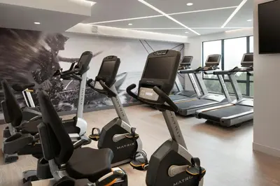 a gym with a bunch of treadmills at Vancouver Airport Marriott Hotel in Richmond