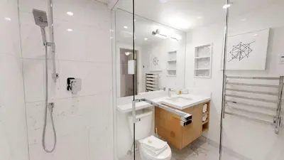 a bathroom with a shower and a sink and a toilet at Powderhorn by Whistler Blackcomb Vacation Rentals in Whistler