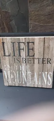 a sign that reads life is better than other instruments at Deer Ridge B&B in Golden