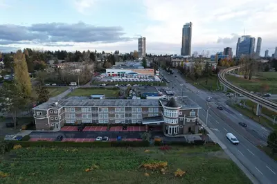 an aerial view of a city with a highway at Days Inn by Wyndham Surrey in Surrey