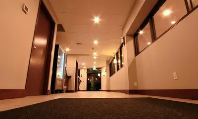 a hallway of a building with a rug on the floor at Super 8 by Wyndham Kelowna BC in Kelowna