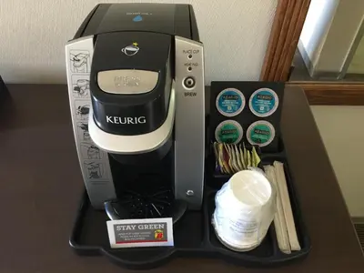 a kinking appliance sitting on top of a table at Super 8 by Wyndham Kelowna BC in Kelowna