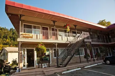 a building with a staircase on the side of it at The Classic Horseshoe Bay Motel in Horseshoe Bay