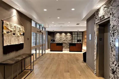 a hallway of a building with wooden floors and a lobby at Delta Hotels by Marriott Kamloops in Kamloops