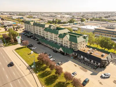 an aerial view of a city with a building at Holiday Inn Conference Centre Edmonton South by IHG in Edmonton