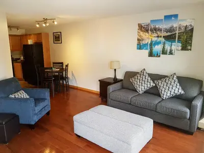 a living room with a couch and a chair at PRC Annex - Pet Friendly in Canmore