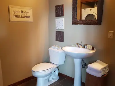a bathroom with a toilet and a sink at PRC Annex - Pet Friendly in Canmore