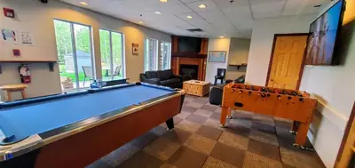 a living room with a pool table in it at PRC Annex - Pet Friendly in Canmore