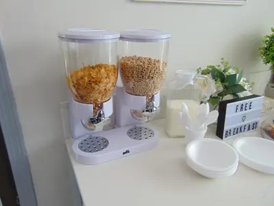 a counter with two blenders filled with food at Chateau Motel in Edmonton