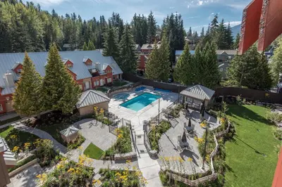 an aerial view of a house with a pool and yard at Lake Placid Lodge by Whiski Jack in Whistler