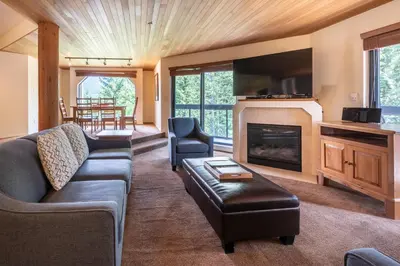 a living room with a couch and a fireplace at The Ironwood on Blueberry Hill in Whistler