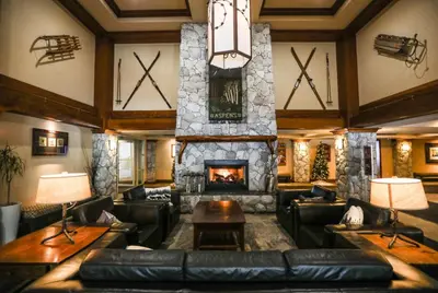 a living room with a couch and a fireplace at The Aspens by Whiski Jack in Whistler