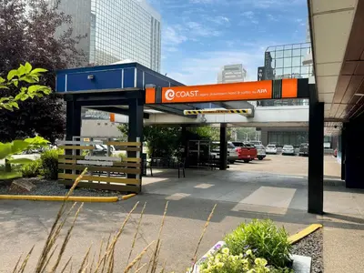 a gas station with a blue and orange sign at Coast Calgary Downtown Hotel & Suites by APA in Calgary