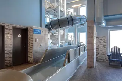 a water slide in a building with a slide at Days Inn by Wyndham Calgary North Balzac in Balzac